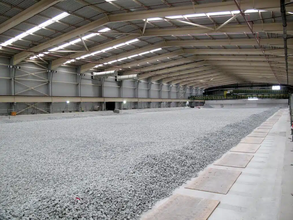 SonaSpray K-13 acoustic ceiling spray in grey to acoustically treat waste management facility.